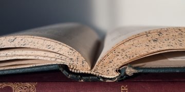A stack of colorful books representing STEM education for kids.