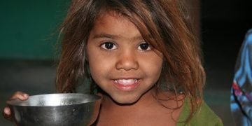 Young girl peacefully sleeping, highlighting the importance of kids' sleep patterns.