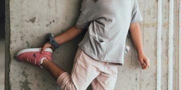 A child playing outside, promoting proactive strategies against childhood obesity.