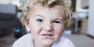 Parents engaging with their children, embodying expert parenting strategies for happiness and success.