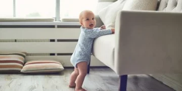 A toddler playing happily, representing the importance of strong family bonds.