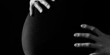 Pregnant woman in a hospital setting, highlighting the importance of cesarean sections.